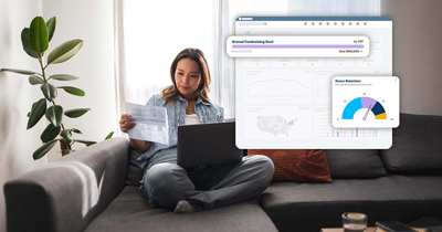 Woman reading letter on sofa working