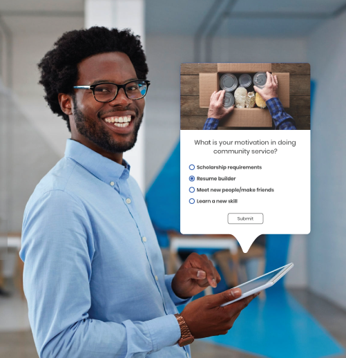 man smiling while using tablet to create an email with constant contact