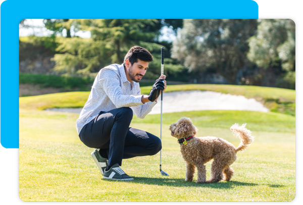 Guy golfing with dog