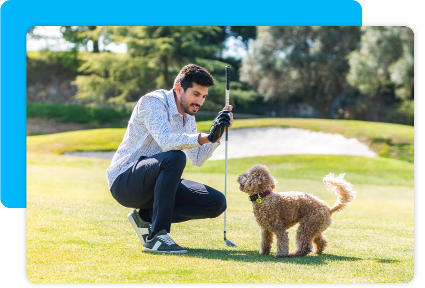 Man plays with dog during a fundraising event. 