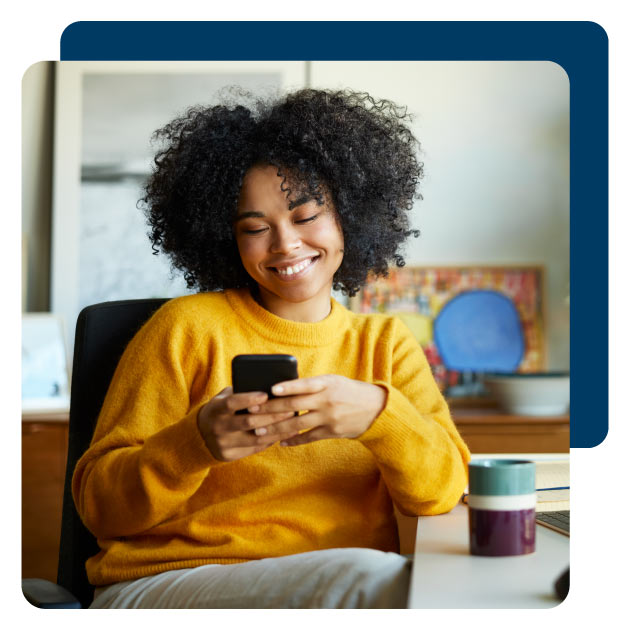 person smiling at post-event message on smart phone 