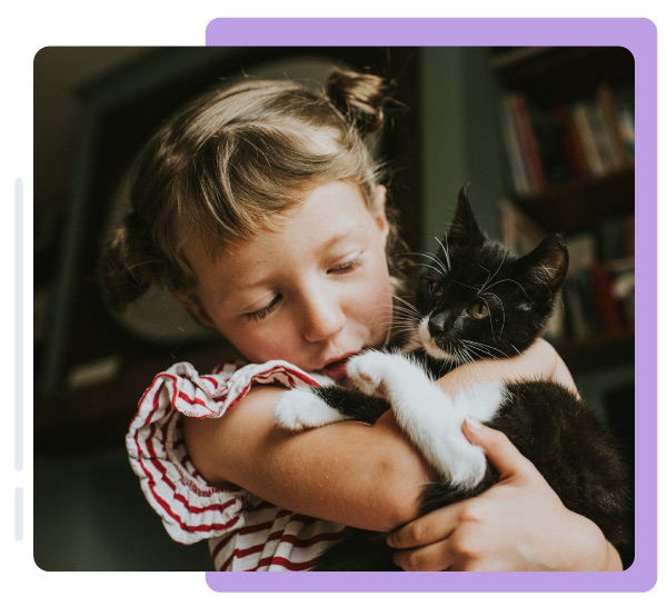 Girl hugging rescue kitten