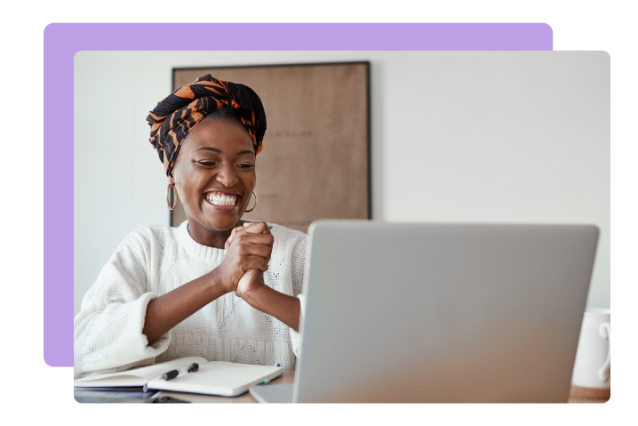 Nonprofit professional excitedly looking at DonorPerfect special offers on her laptop