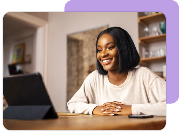 Woman smiling at computer