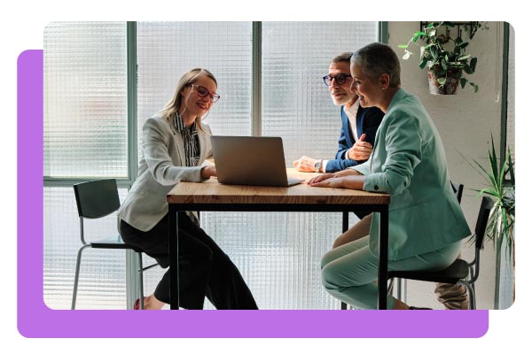 A financial advisor meeting with clients