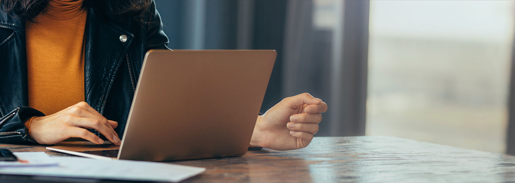 Image of a computer on a desk in an office setting. 