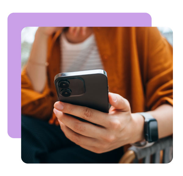 Close up shot of a young Asian woman using smartphone while sitting in an outdoor cafe and drinking coffee. Lifestyle and technology
