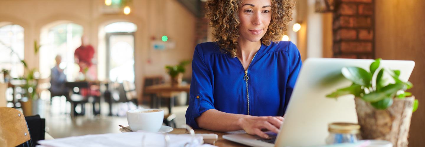 Nonprofit employee working in their CRM on their laptop