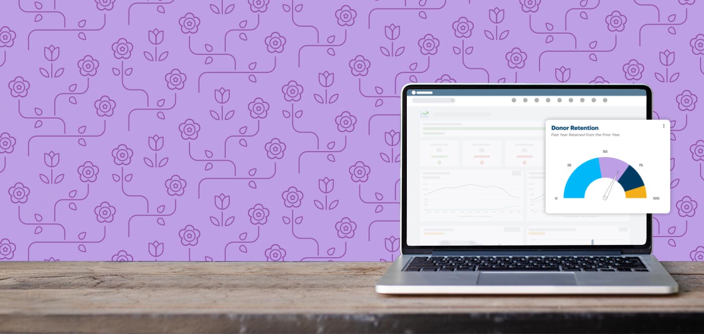 Image of the the DonorPerfect software on a laptop with a floral pattern in the background.
