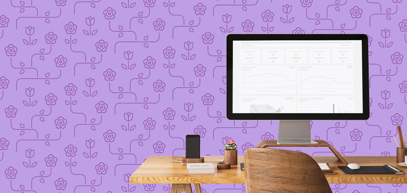 Image of a computer with DonorPerfect on the screen with a floral patter in the background.