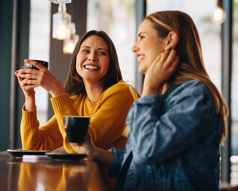 To ladies talking over coffee