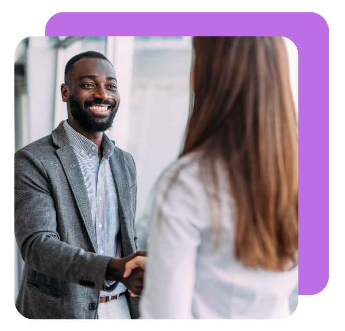 Business people shaking hands in the office. Business persons handshaking during a meeting in modern office.