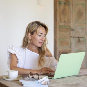 A woman writing Annual Reports.