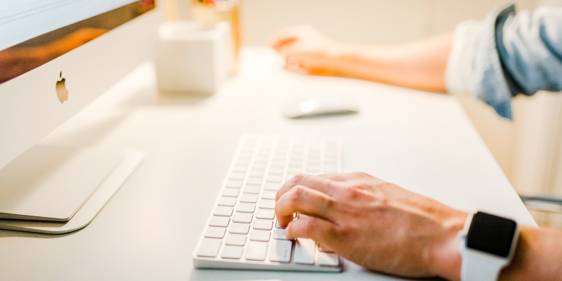 person typing on computer