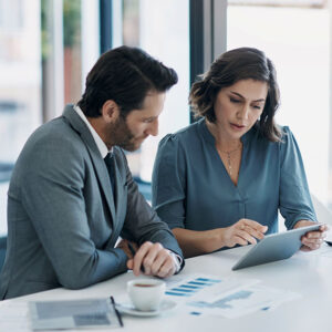 Two people discussing corporate giving.