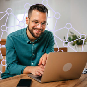 Man on computer with connection lines surrounding him