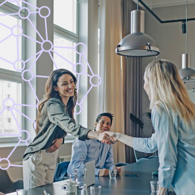 Business women shaking hands