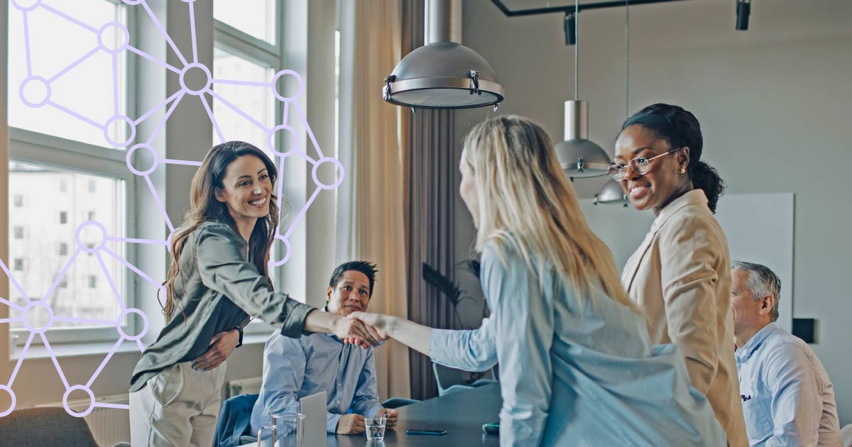 Business women shaking hands