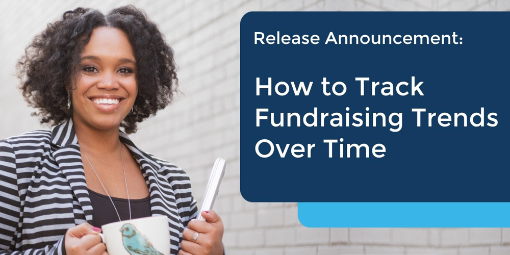Track fundraising trends with DP Dashboard - image of woman smiling with laptop.