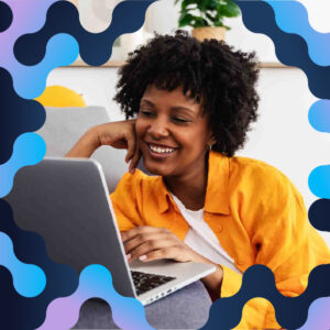 A woman on her laptop with 2025 DPC branding.