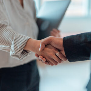 Cropped shot of business people standing in a modern office, shaking hands after having a successful meeting and reaching an agreement. Welcoming new hire. Celebrating success and achievement.