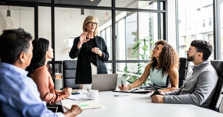 Business colleagues meeting in modern conference room