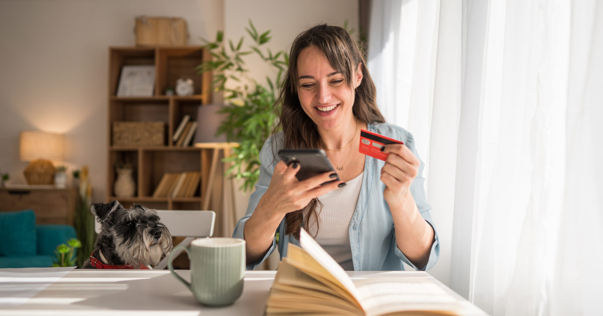 Woman using a credit card to donate on her phone