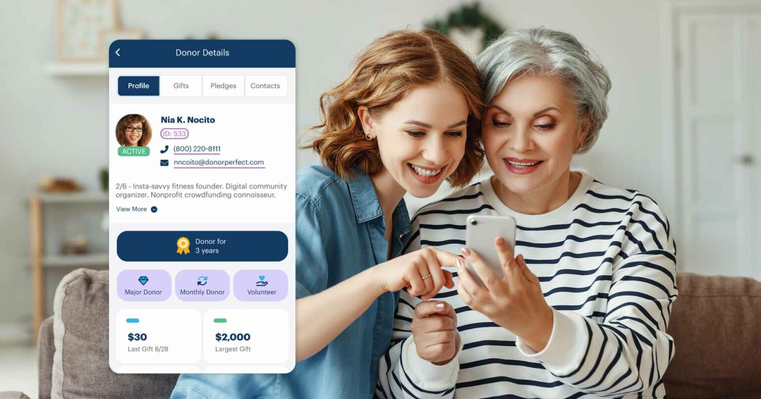 Two women using the DP mobile app.