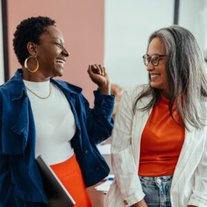 Donor and Nonprofit worker engaged in a friendly conversation.