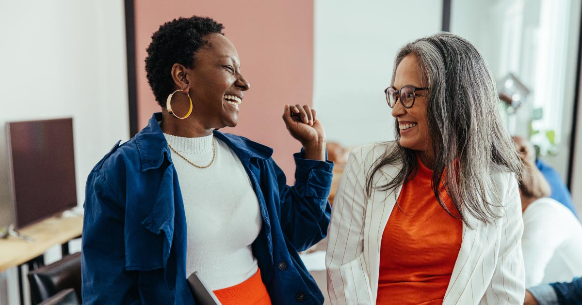 Donor and Nonprofit worker engaged in a friendly conversation.