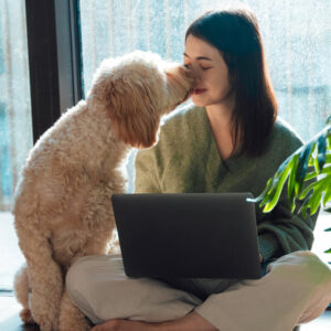woman working with a loving dog