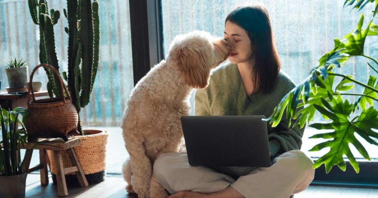 woman working with a loving dog