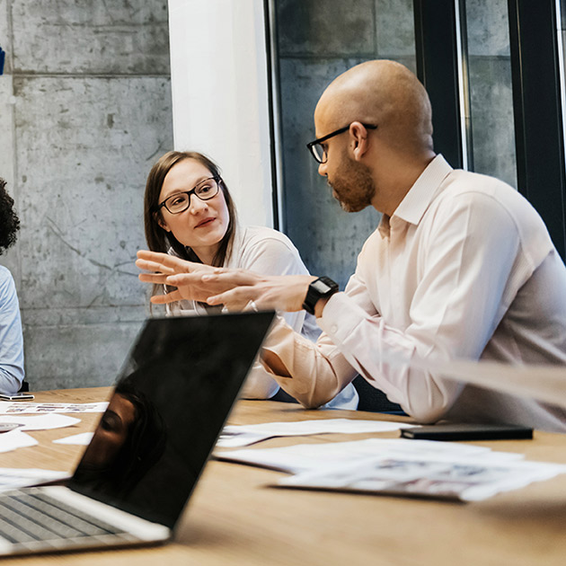 A group of people planning at a desk.