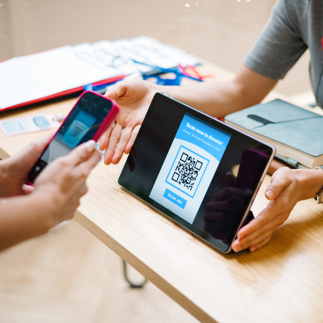 Donor scanning a QR code to easily get to a donation form featured image