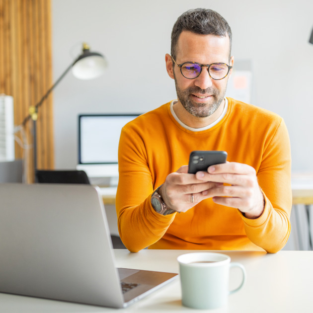 Man working in an office using DonorPerfect and Sage