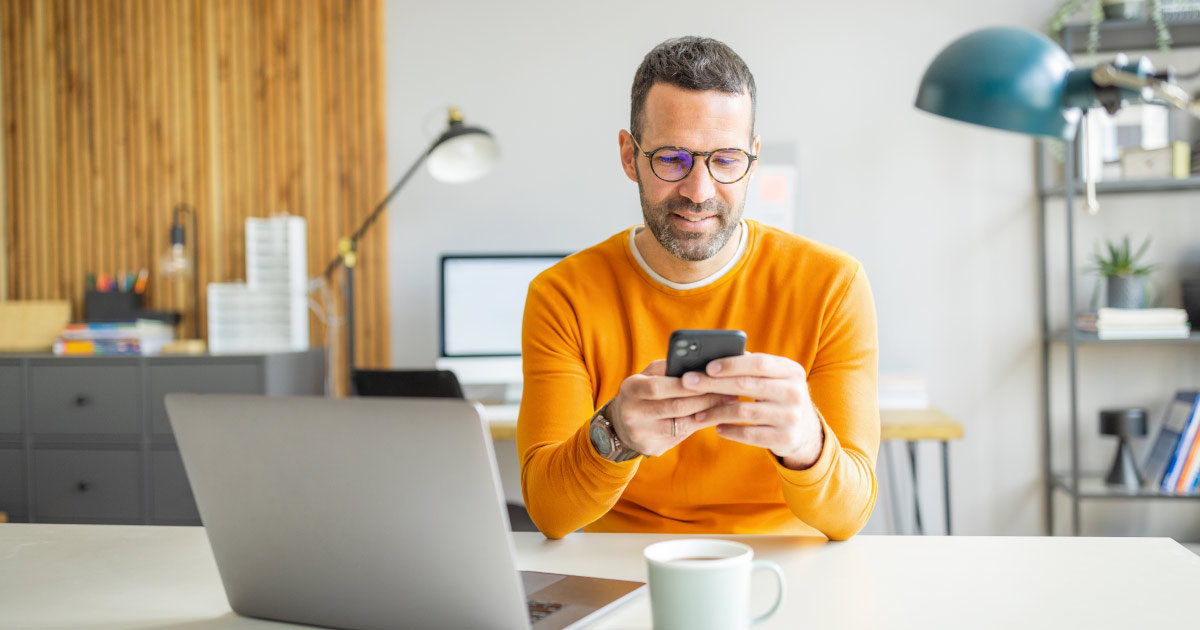 Man working in an office using DonorPerfect and Sage
