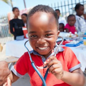 Shot of a volunteer doctor giving checkups to underprivileged kids