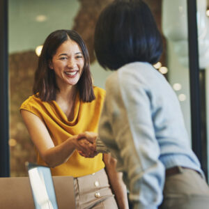 nonprofit employee shakes hands with a major donor
