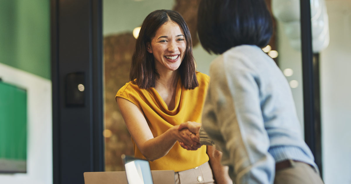 nonprofit employee shakes hands with a major donor