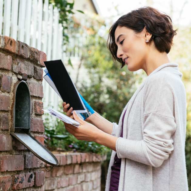 woman checking mail box