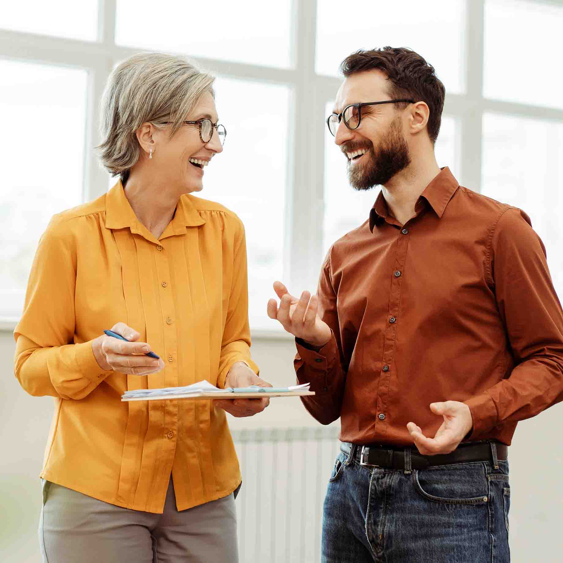 Two people talking about Grant Writing.
