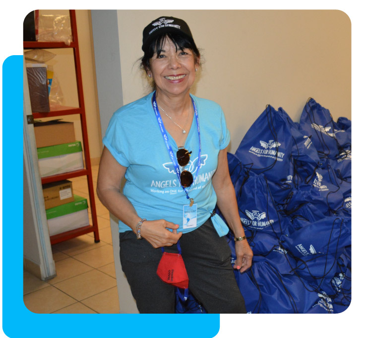 Volunteer smiling and giving time to organization