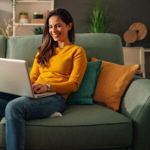 A woman working on her laptop.