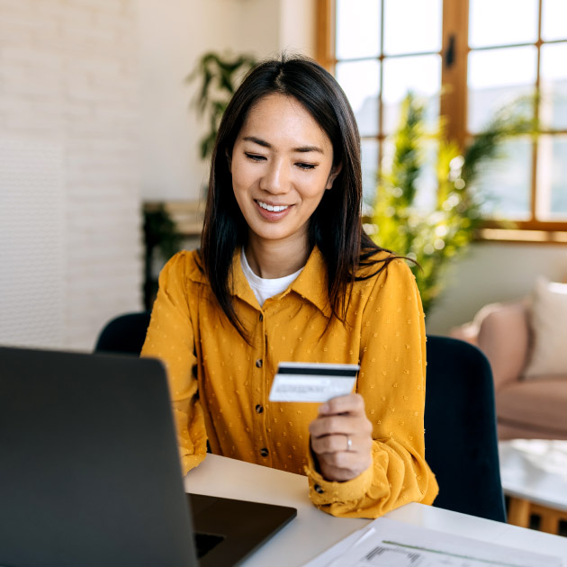 employee using a credit card to make an online donation to their favorite nonprofit