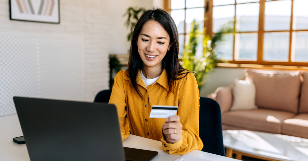 employee using a credit card to make an online donation to their favorite nonprofit