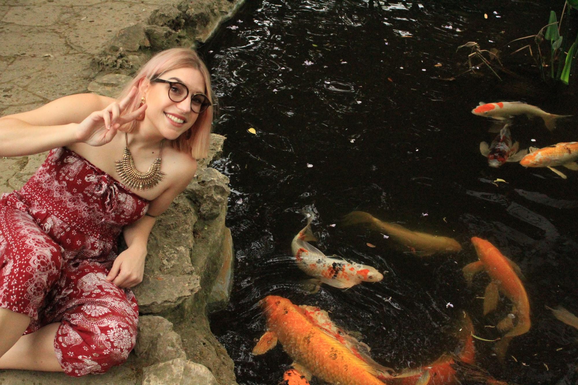 Laura next to koi pond